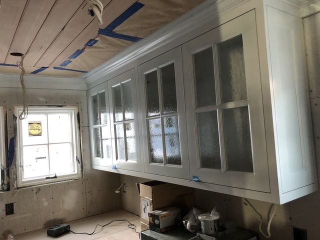 White upper cabinets with glass doors