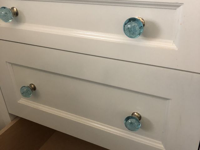 White drawers with glass knobs