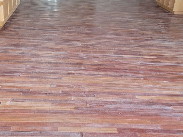 Long room with newly finished wood floors
