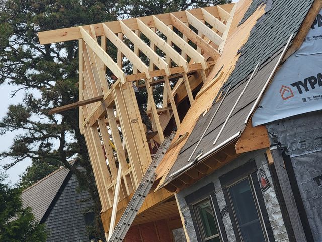 New roof framing tied into an existing roof