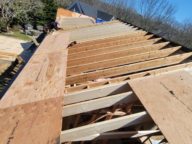 Rafters with roof sheathing going on