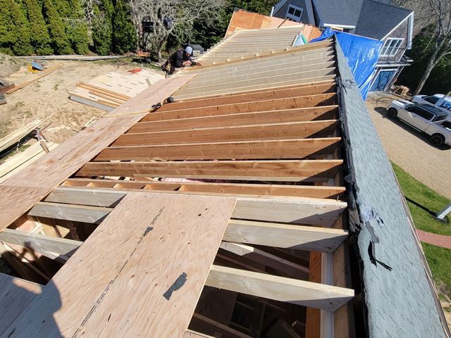 Roof sheathing over new rafters