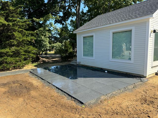 Bluestone patio next to a cottage