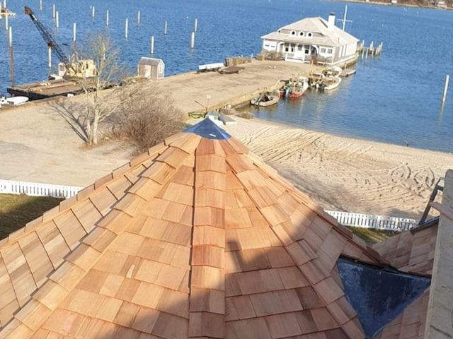 Wood shingle roof with water view