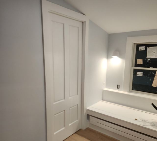Paneled door and window seat